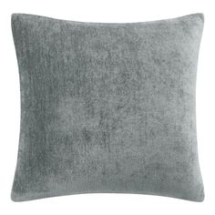 a grey velvet pillow on a white background