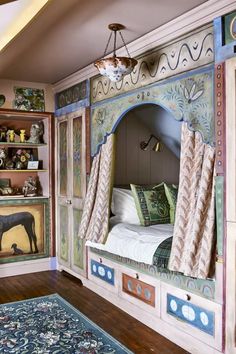 a bedroom with painted walls and wooden floors, including a bed that has curtains on it