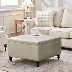 a living room scene with focus on the ottoman