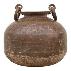 an old brown vase with two handles on it