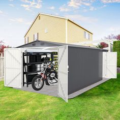 a motorcycle is parked in the back of a storage shed with its doors open on grass