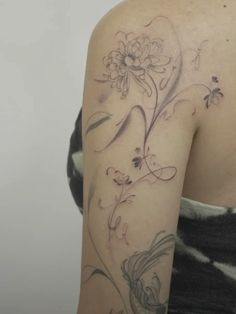 a woman with a tattoo on her arm