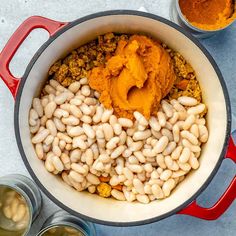 a pot filled with beans and some spices