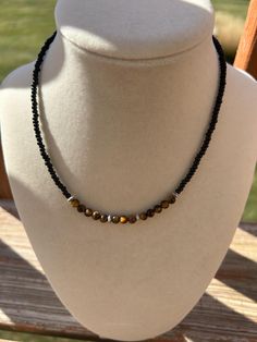 Boho black seed bead choker featuring dainty tigers eye beads. 15 inches long. Seed Bead Choker, Bead Choker, Crystal Lake, Black Seed, Tiger Eye Beads, Eye Beads, Choker Necklaces, Tigers Eye, Beaded Choker