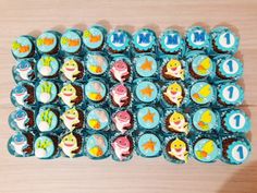 cupcakes decorated with different types of sea animals on top of each other,