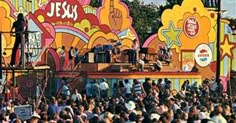 a large group of people standing on top of a stage