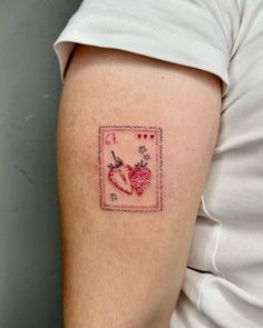 a person with a small tattoo on their arm