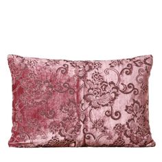 a pink and brown pillow on a white background