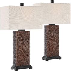 two brown and white lamp shades on each side of the lamps, one with an animal print