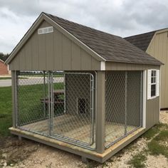 a dog house with a fence around it