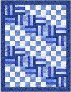 a blue and white quilt with squares on it