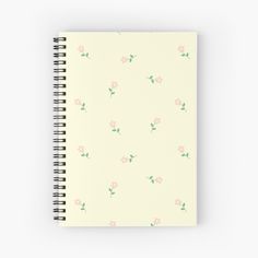 a spiral notebook with pink flowers on it