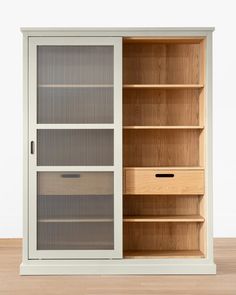 an empty bookcase with two drawers in it