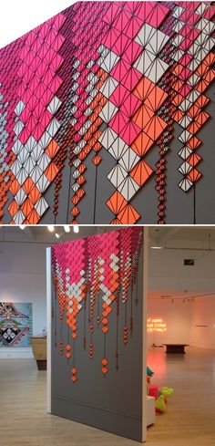 two pictures with different designs on the wall and in the background, there is a sculpture made out of plastic beads