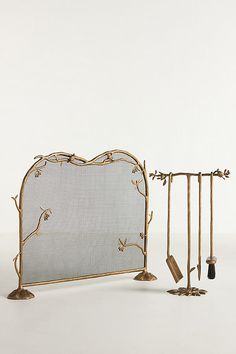 there is a metal bed frame with tools on the top and bottom, as well as an iron headboard