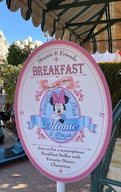 a sign for the disneyland world breakfast