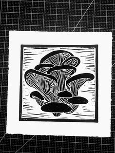 a black and white drawing of mushrooms on a piece of paper