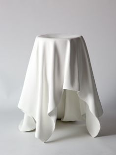 a white table cloth with ruffles on it