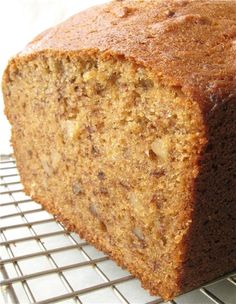 a loaf of banana bread sitting on top of a cooling rack