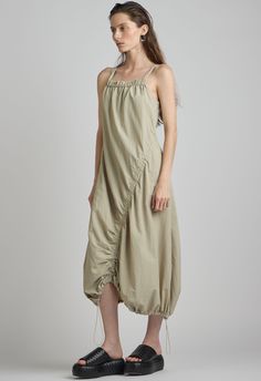 One size. Fits XS-LColor: Khaki Lightweight materialSquare-neckSide Ruching with Adjustable Toggle Drawstring on Hem100% NylonDry CleanBy The NKC Store Product Measurements:Bust: 76.2cm / 30in Hip: 81.2cm / 32inLength: 91.4cm / 36in Stretch Khaki Full-length Parachute Pants, Khaki Stretch Full-length Parachute Pants, Khaki Cotton Cargo-style Parachute Pants, Khaki Full-length Parachute Pants With Side Pockets, Khaki Full-length Parachute Pants With Patch Pockets, Parachute Dress, Khaki Dress, Mid Dresses, Color Khaki