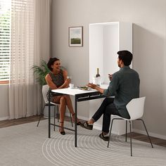 a man and woman sitting at a table having a conversation