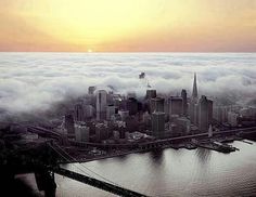 an aerial view of the city and bridge