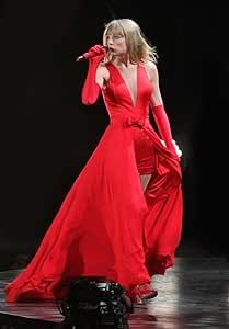 a woman in a red dress on stage