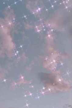 the sky is filled with stars and clouds