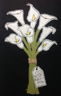 a bouquet of white flowers with a price tag attached to the stems on a black background