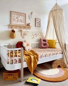 a child's bedroom with a canopy bed and rugs