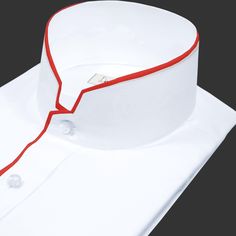 High Roman Stand collar Shirt Tailor-Made On Order shirt 𝘈 𝘩𝘪𝘨𝘩 𝘤𝘰𝘭𝘭𝘢𝘳 𝘴𝘩𝘪𝘳𝘵 𝘪𝘴 𝘢 𝘤𝘭𝘢𝘴𝘴𝘪𝘤 𝘢𝘯𝘥 𝘵𝘪𝘮𝘦𝘭𝘦𝘴𝘴 𝘴𝘵𝘺𝘭𝘦 𝘵𝘩𝘢𝘵 𝘢𝘥𝘥𝘴 𝘢 𝘵𝘰𝘶𝘤𝘩 𝘰𝘧 𝘴𝘰𝘱𝘩𝘪𝘴𝘵𝘪𝘤𝘢𝘵𝘪𝘰𝘯 𝘵𝘰 𝘢𝘯𝘺 𝘰𝘶𝘵𝘧𝘪𝘵. 𝘛𝘩𝘪𝘴 𝘴𝘵𝘺𝘭𝘦 𝘧𝘦𝘢𝘵𝘶𝘳𝘦𝘴 𝘢 𝘤𝘰𝘭𝘭𝘢𝘳 𝘵𝘩𝘢𝘵 𝘴𝘵𝘢𝘯𝘥𝘴 𝘶𝘱 𝘢𝘯𝘥 𝘦𝘯𝘤𝘪𝘳𝘤𝘭𝘦𝘴 𝘵𝘩𝘦 𝘯𝘦𝘤𝘬, 𝘱𝘳𝘰𝘷𝘪𝘥𝘪𝘯𝘨 𝘢 𝘳𝘦𝘧𝘪𝘯𝘦𝘥 𝘢𝘯𝘥 𝘱𝘰𝘭𝘪𝘴𝘩𝘦𝘥 𝘭𝘰𝘰𝘬. 𝘐𝘵'𝘴 𝘢 𝘷𝘦𝘳𝘴𝘢𝘵𝘪𝘭𝘦 𝘱𝘪𝘦𝘤𝘦 𝘰𝘧 𝘤𝘭𝘰𝘵𝘩𝘪𝘯𝘨 Classic Cotton Shirt With Stand Collar, Formal White Tops With Placket, White Formal Tops With Placket, Classic White Fitted Collars, Classic Shirt With Stand Collar And Placket, White Fitted Top With Johnny Collar, Formal Cotton Top With Johnny Collar, White Cotton Shirt With Johnny Collar, Formal Cotton Top With Stand Collar