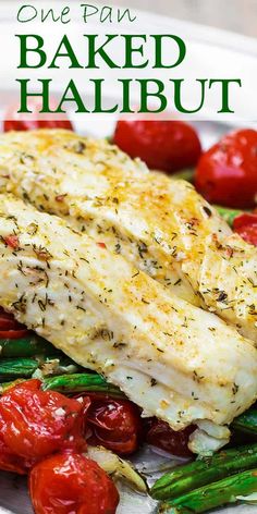 baked halibut on a plate with tomatoes and asparagus