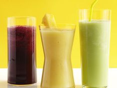 three different types of smoothies sitting on a table