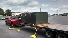 a flatbed truck with an electrical box on the back