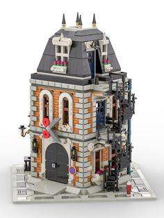 a lego model of a building with a clock on the front and side of it