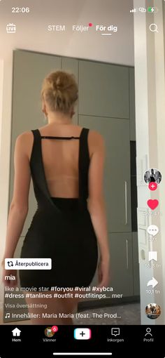 the back of a woman's dress is shown in an instagramtion video