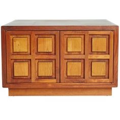 a wooden sideboard with many squares on it's front and back panels, made out of wood