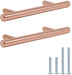 two rose gold cabinet handles with screws and nails