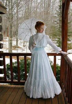 Dreamy white cotton eyelet lace dress with a lining in soft cotton is styled from the Edwardian era. The loose bodice buttons in the back and the skirt gets progressively fuller with flounces of the eyelet. Satin ribbon trims the flounced length sleeves and the waist is finished with a buttoned belt, which is included. Classical Dresses, Inspirational Characters, Dream Cosplay, Period Dresses, Edwardian Dresses, Edwardian Gowns, Historical Sewing, 1900 Fashion, Retro Clothes