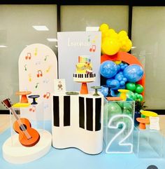 an assortment of musical instruments and balloons on display