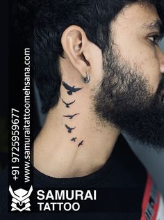 there is a man with birds on his neck and behind the ear that reads samurai tattoo