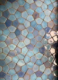 a tile floor with blue and white tiles on it