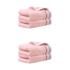 two pink towels stacked on top of each other