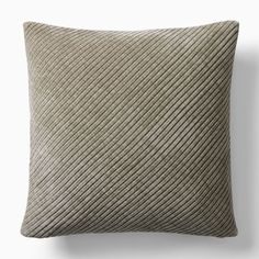 a beige pillow with an intricate pattern on it