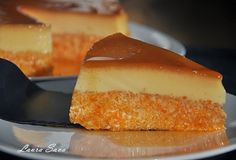 a piece of cheesecake sitting on top of a plate next to another slice of cake