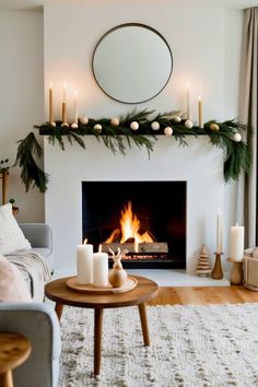 a living room filled with furniture and a fire place in front of a mirror on the wall