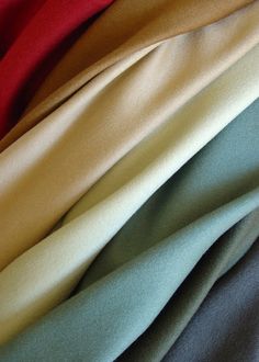 several colors of fabric stacked on top of each other