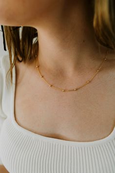 Our Dainty Gold Ball Chain Necklace is the perfect layering piece for your jewelry collection! Made with 24K Gold Filled metal, this necklace will not tarnish and is water prooff. Length: 18 InchesWidth : 1.3MM, BEAD-3.0MMIt has a spring clasp closure. Gold Ball Chain, Ball Chains In Gold, Everyday Gold Ball Chain Necklace, Gold Choker With Satellite Chain, Gold Plated Ball Chain Necklace Gift, Gold Choker Necklace With Satellite Chain, Gold Station Necklace With Satellite Chain, Gold Satellite Chain Choker Necklace, Ball Chain Link Necklace For Gifts