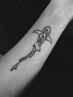 a black and white photo of a person's arm with a tattoo on it