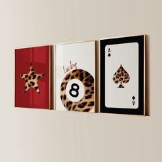 three framed art pieces with cards and numbers on them, each featuring a number eight